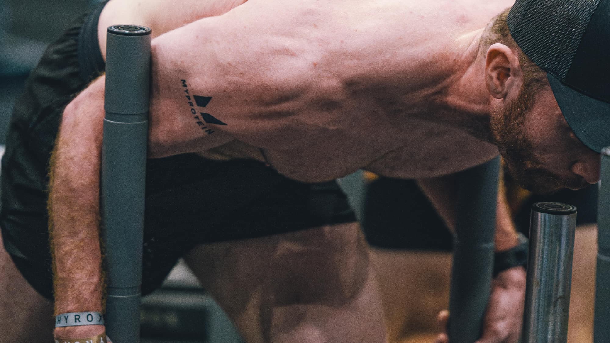 A deep sled push at full effort, side on
