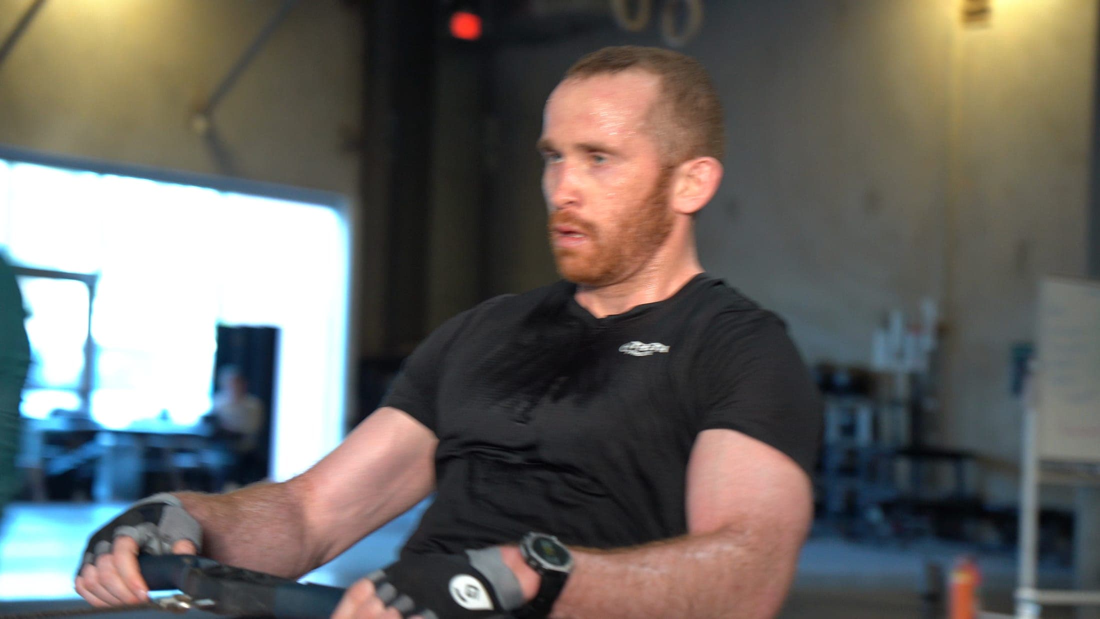 An athlete on a rowing machine